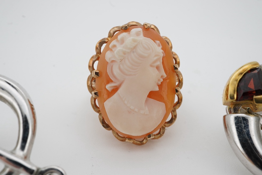 A 9ct gold shell cameo ring, size N, British hallmarks, gross weight 6 grams, and a pair of blue topaz and earrings, mounted in silver, length 5.1cm each, post fittings, Condition: good